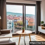 코소보 거주비용 - A cozy modern apartment interior in Pristina city center, featuring a furnished living room with a c...